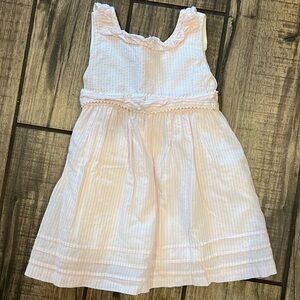 White and pink seersucker dress with bow tie in the back.